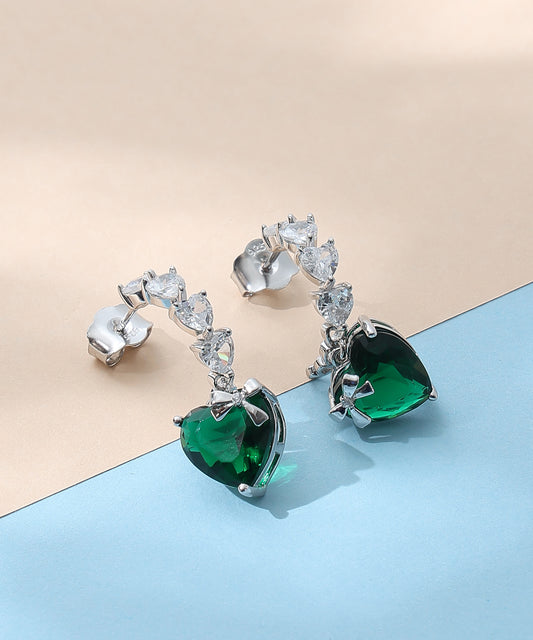 Siora Jewels Emerald Heart 925 Silver Earrings for Women | Rhodium Finish with Zircon Detailing & Bow Accent